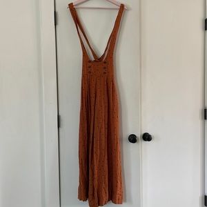 Free People rust colors jumper with black polka dots and suspenders